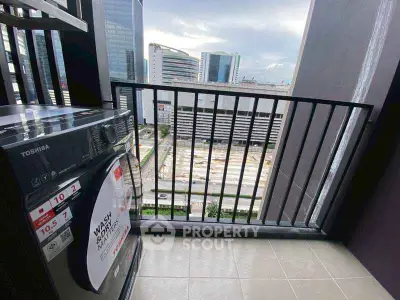 Modern balcony with city view and washing machine, perfect urban living space.