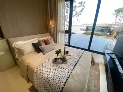 Luxurious bedroom with stunning water view and elegant decor