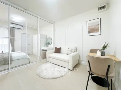 Modern studio apartment with stylish decor and mirrored wardrobe