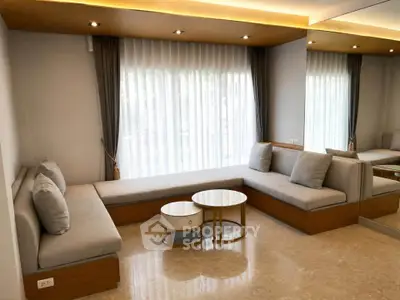 Elegant modern living room with stylish seating and natural light