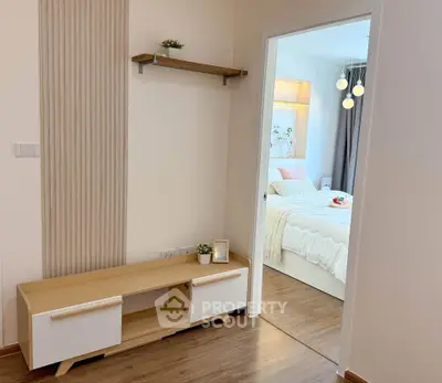 Cozy bedroom with modern decor and wooden flooring