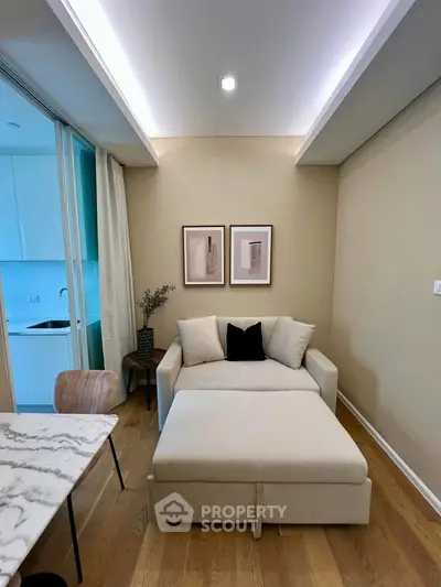Cozy living room with modern sofa and elegant decor in a stylish apartment.