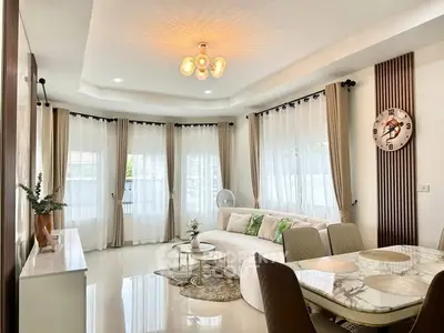 Elegant living room with modern decor and natural light