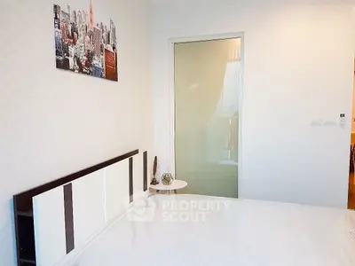 Modern bedroom with stylish decor and sliding glass door