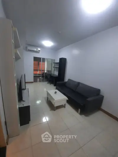 Modern living room with sleek furniture and bright lighting