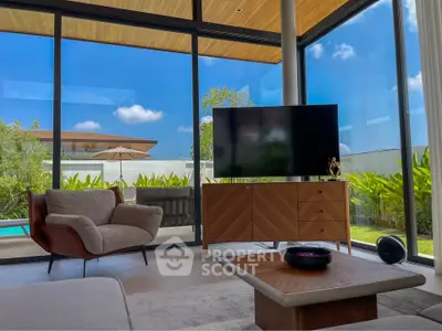 Luxurious living room with modern furniture and stunning garden view through large windows.