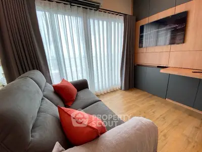 Cozy living room with modern decor and large window view
