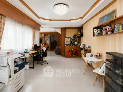Spacious home office with elegant decor and ample natural light