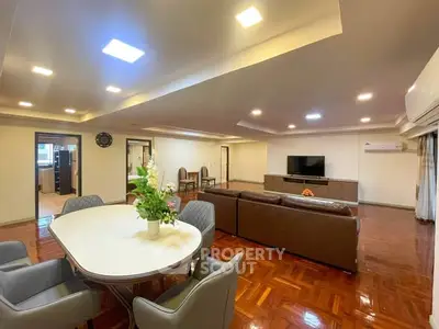 Spacious living room with elegant dining area and modern decor