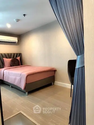 Cozy bedroom with elegant decor and soft lighting, featuring a stylish bed and modern furnishings.