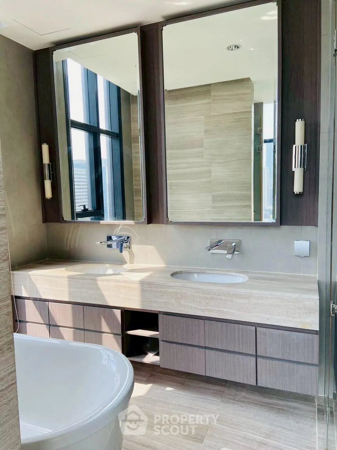 Luxurious modern bathroom with dual sinks and large mirrors