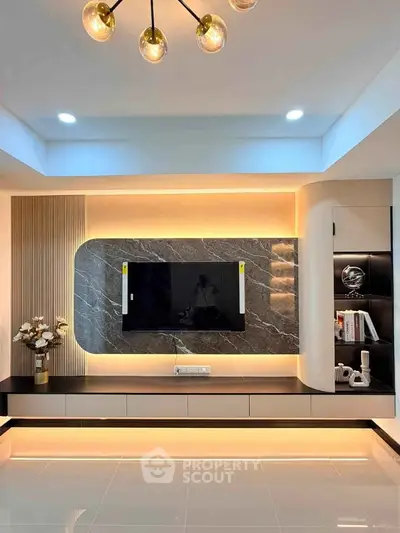 Modern living room with sleek TV wall unit and ambient lighting