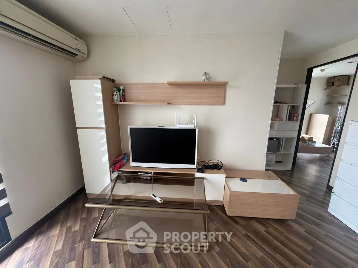 Modern living room with sleek TV unit and stylish wooden flooring