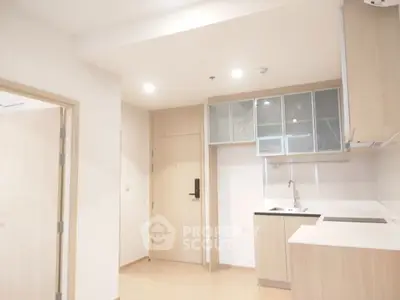 Modern minimalist kitchen with sleek cabinetry and integrated appliances