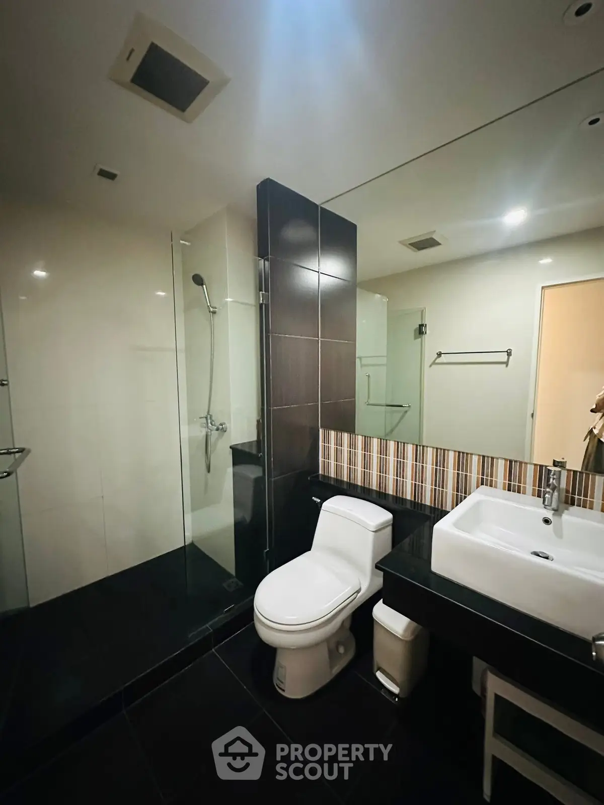 Modern bathroom with sleek design and glass shower enclosure
