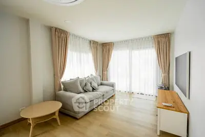 Bright and airy living room with modern decor and large windows