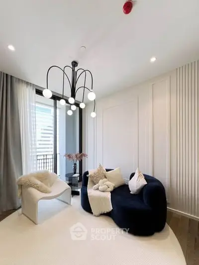 Elegant modern living room with stylish furniture and unique lighting fixture