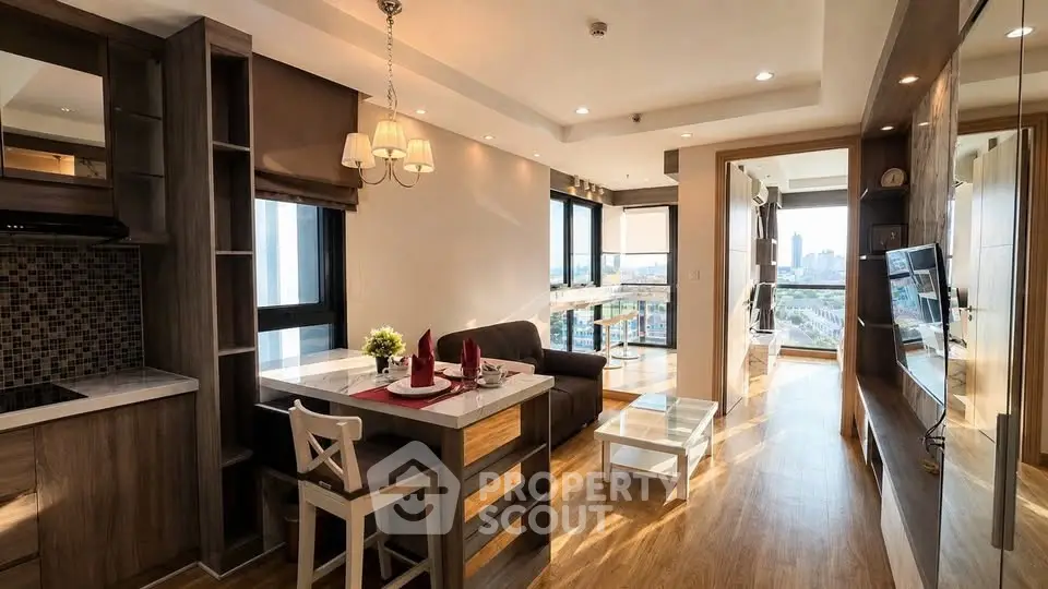 Modern open-plan living room with dining area and city view, featuring elegant decor and natural light.