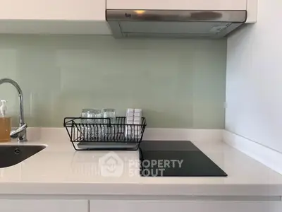Modern kitchen with sleek induction cooktop and minimalist design