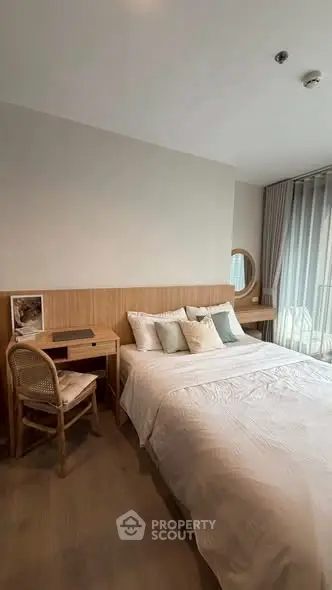 Cozy bedroom with modern decor and natural light