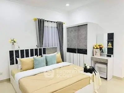 Elegant bedroom with modern decor, featuring a cozy bed, stylish curtains, and a sleek wardrobe.