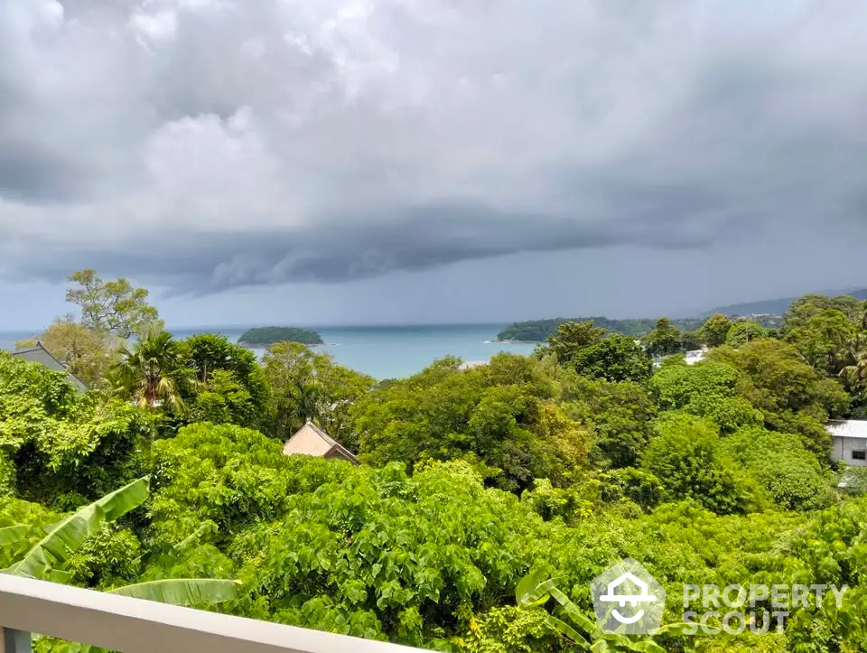 Stunning ocean view from lush green balcony, perfect for serene living.