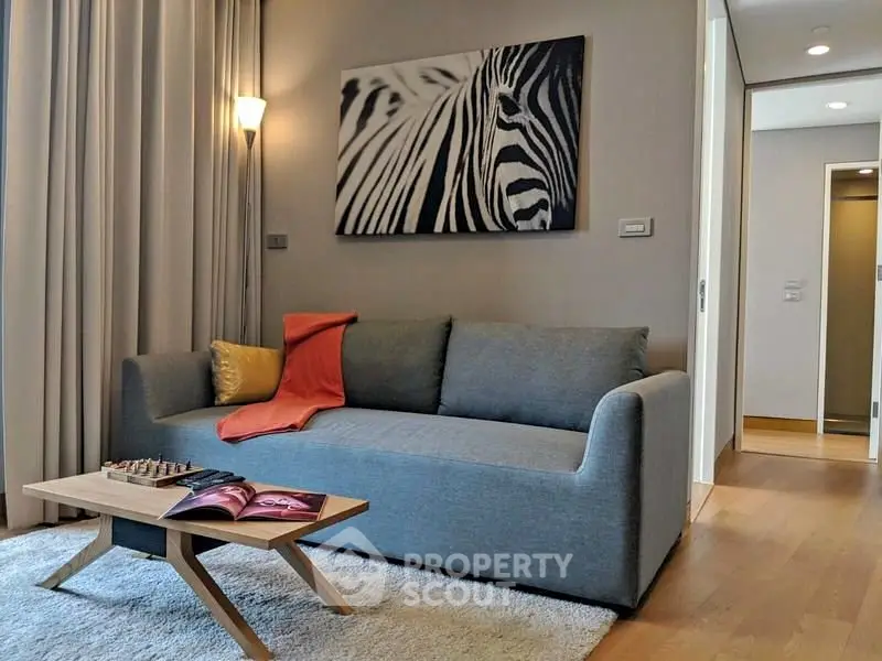 Modern living room with stylish sofa and zebra art decor