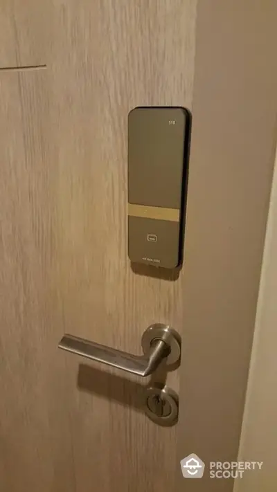 Modern apartment door with sleek electronic lock system for enhanced security.