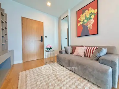 Modern living room with stylish decor and cozy sofa in a contemporary apartment.