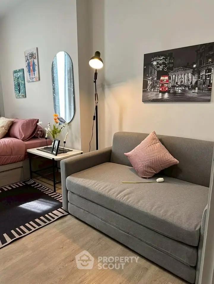 Cozy living room with modern decor and comfortable seating in a stylish apartment.