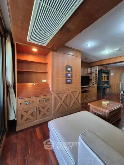 Spacious living room with wooden accents and modern furniture