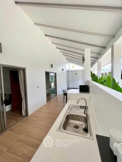 Modern open-air kitchen with sleek design and natural light