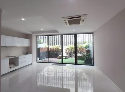 Spacious modern living room with garden view and sleek design