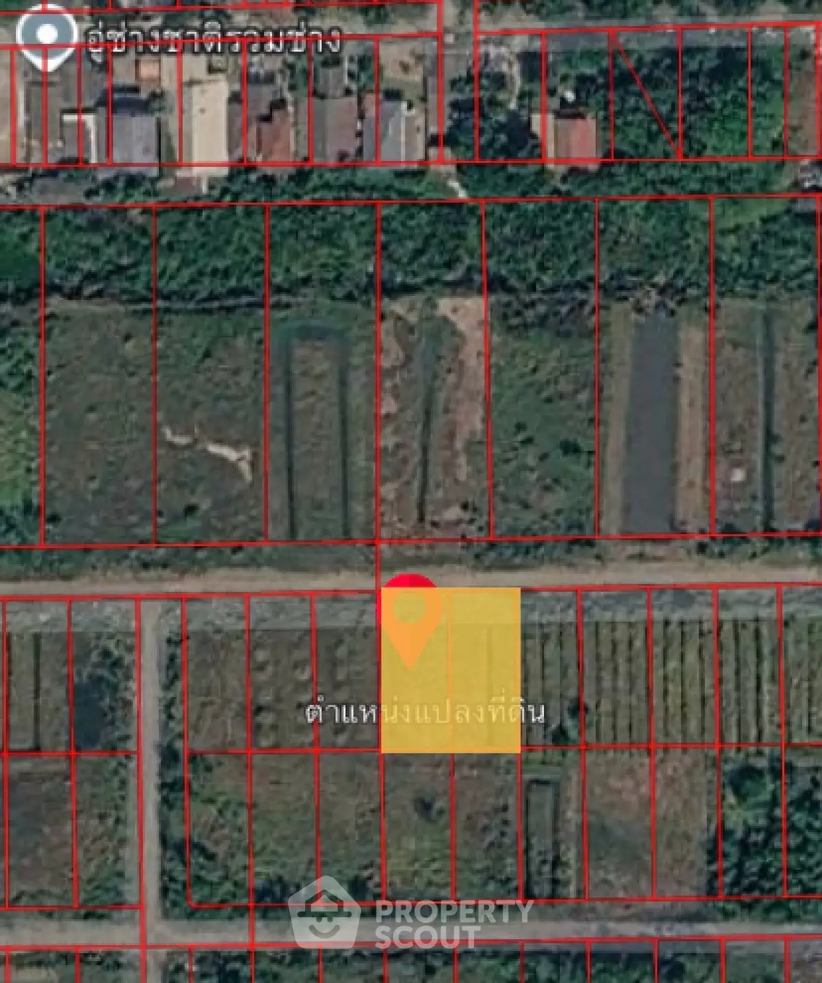 Aerial view of land plots with red boundary lines, ideal for real estate development.