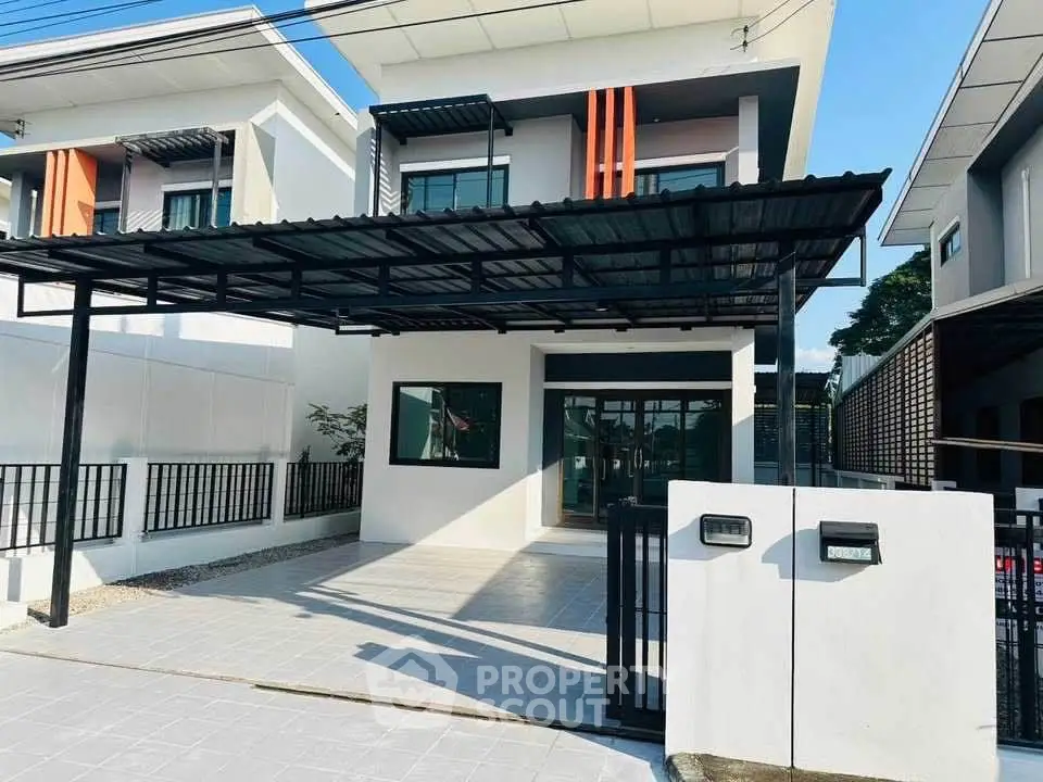 Modern two-story house with carport and sleek exterior design