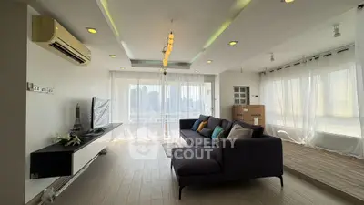 Spacious modern living room with large windows and city view