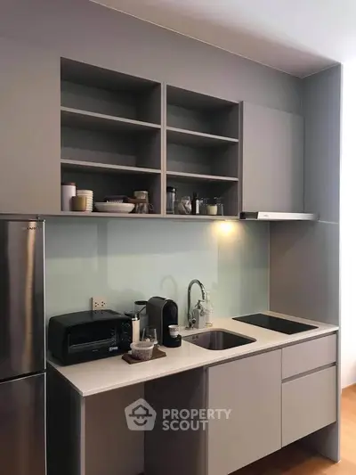 Modern kitchen with sleek cabinetry and stainless steel appliances