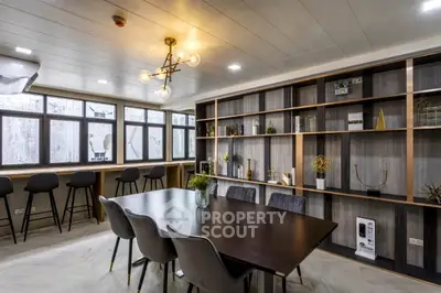 Modern study room with elegant decor and large windows for natural light