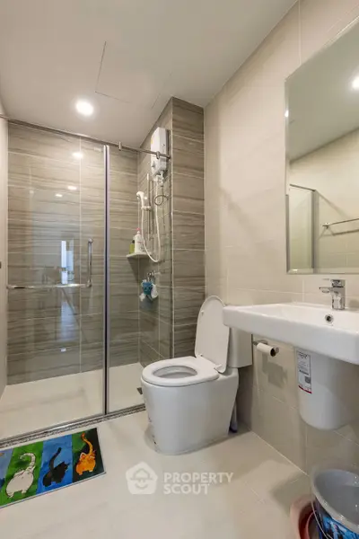 Modern bathroom with glass shower and sleek fixtures