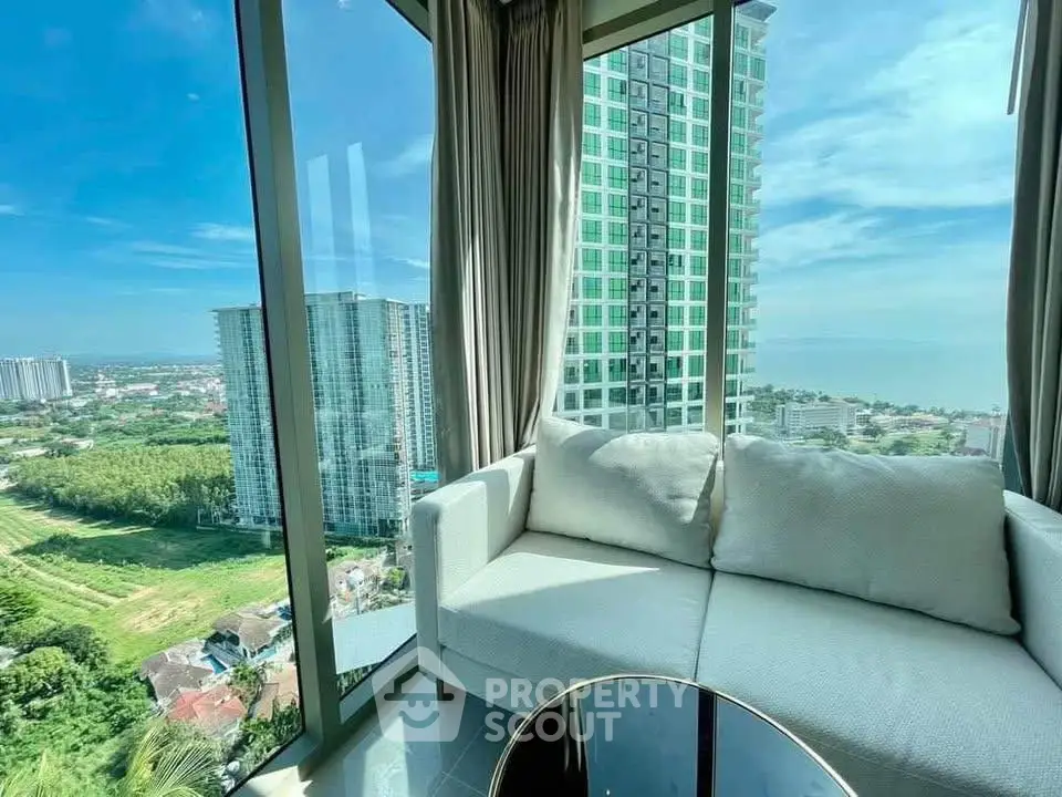 Luxurious corner unit with panoramic city and ocean views from a high-rise apartment.