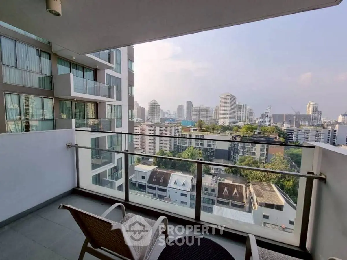 Stunning city view from modern balcony in high-rise apartment