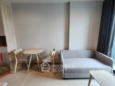 Modern living room with minimalist furniture and natural light