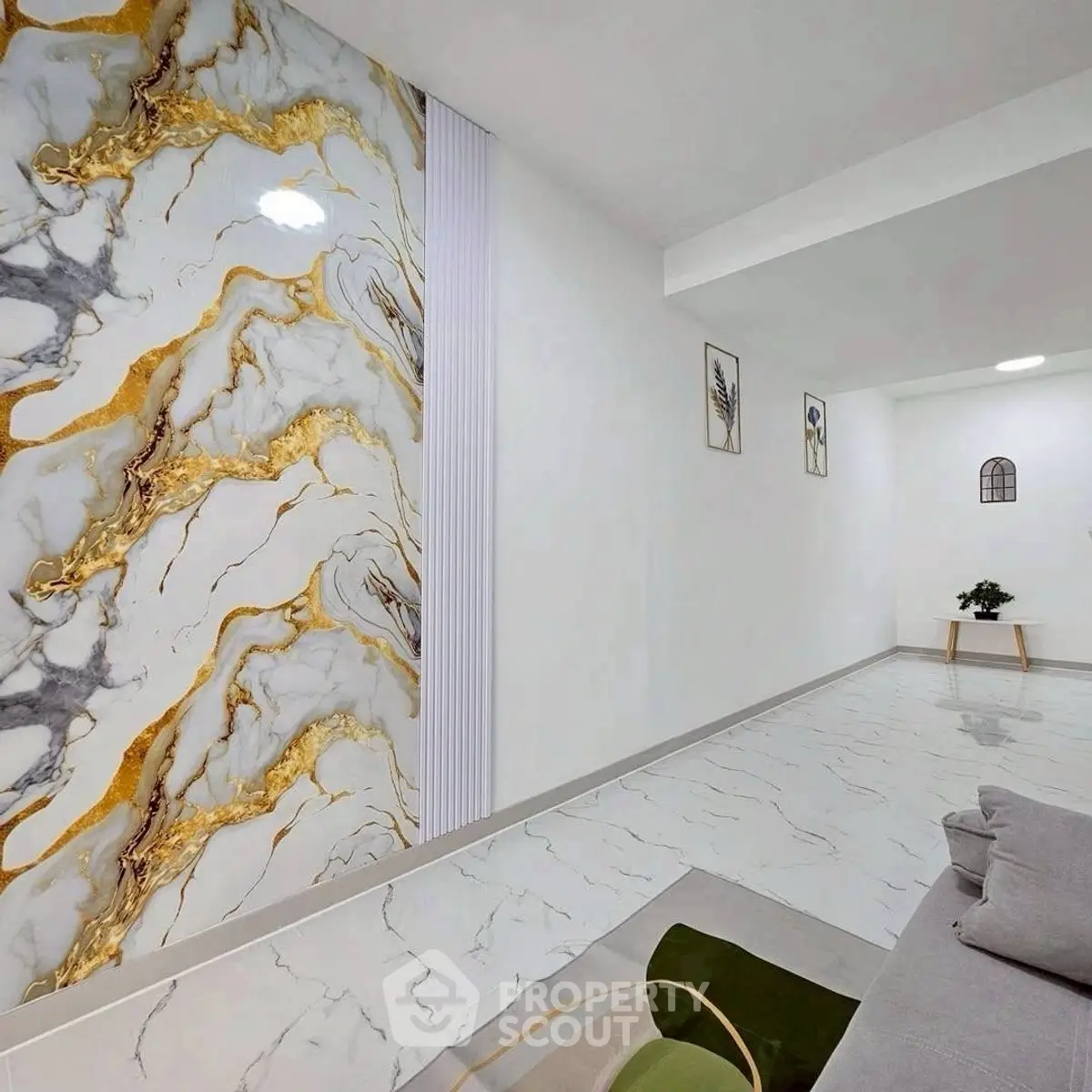 Luxurious modern living room with marble accent wall and elegant decor