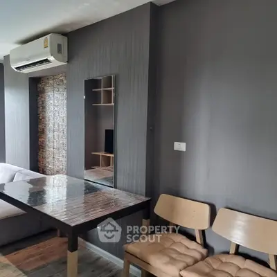 Modern living room with sleek furniture and air conditioning