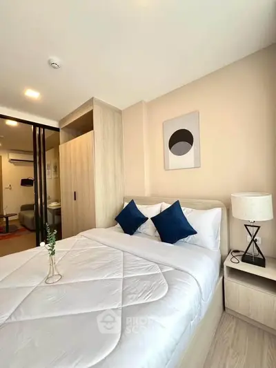 Modern bedroom with stylish decor and cozy ambiance in a contemporary apartment.