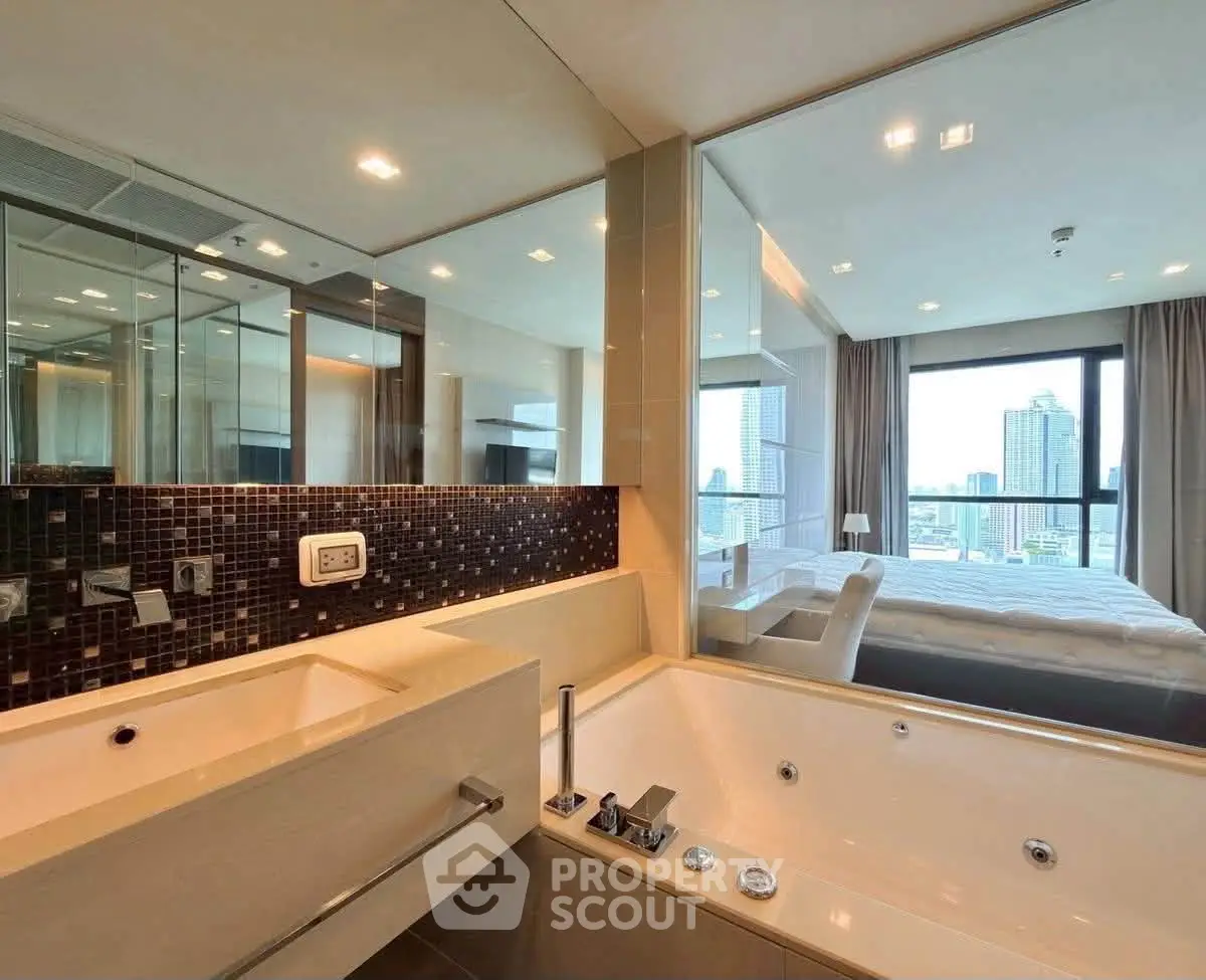 Luxurious modern bathroom with city view and elegant bathtub in high-rise apartment.
