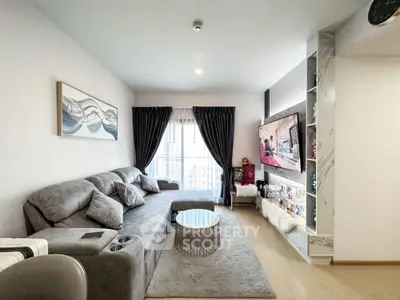 Modern living room with cozy gray sofa and stylish decor