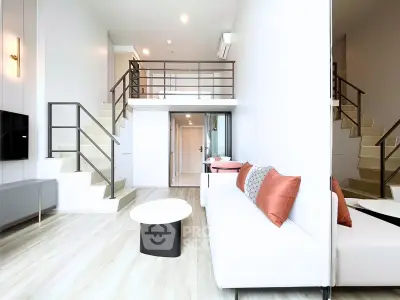 Modern duplex living room with stylish decor and mezzanine level