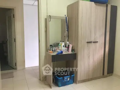 Cozy bedroom with wardrobe and vanity in a modern apartment