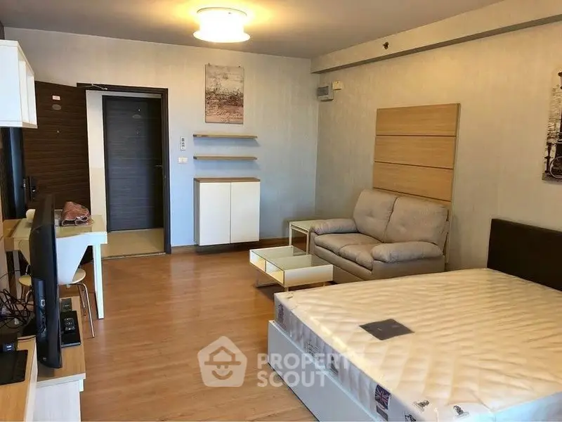 Spacious studio apartment with modern furnishings and cozy ambiance